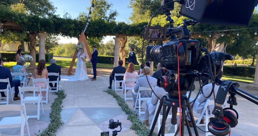 wedding videographer capturing a ceremony