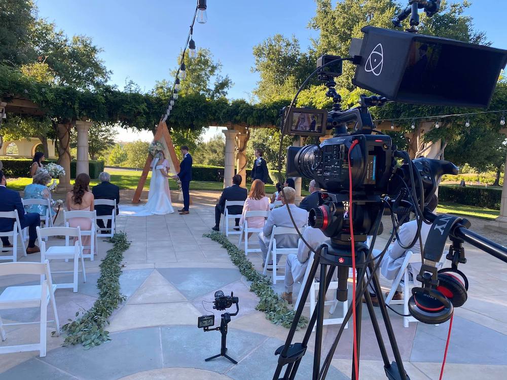 wedding videographer capturing a ceremony